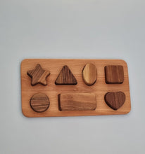 Load image into Gallery viewer, Wooden shape sorting puzzle on a gray background